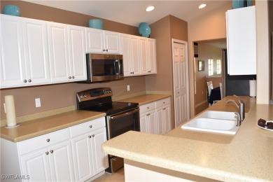GORGEOUS PANORAMIC LAKE VIEWS FROM YOUR SPACIOUS LANAI! Fully on Colonial Country Club in Florida - for sale on GolfHomes.com, golf home, golf lot
