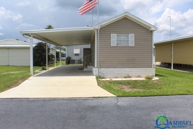 This super fun 1BR/1BA tiny home packs a lot of punch! This home on Lily Lake Golf and RV Resort in Florida - for sale on GolfHomes.com, golf home, golf lot