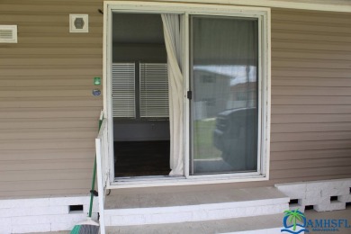 This super fun 1BR/1BA tiny home packs a lot of punch! This home on Lily Lake Golf and RV Resort in Florida - for sale on GolfHomes.com, golf home, golf lot