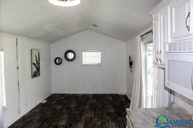 This super fun 1BR/1BA tiny home packs a lot of punch! This home on Lily Lake Golf and RV Resort in Florida - for sale on GolfHomes.com, golf home, golf lot