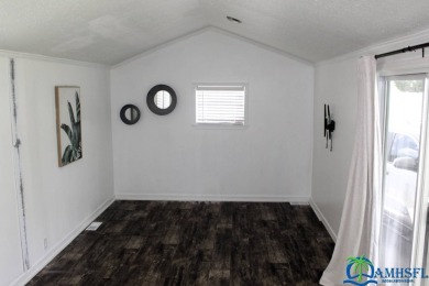 This super fun 1BR/1BA tiny home packs a lot of punch! This home on Lily Lake Golf and RV Resort in Florida - for sale on GolfHomes.com, golf home, golf lot