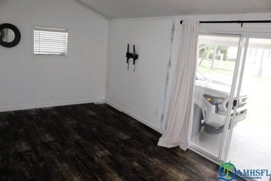 This super fun 1BR/1BA tiny home packs a lot of punch! This home on Lily Lake Golf and RV Resort in Florida - for sale on GolfHomes.com, golf home, golf lot