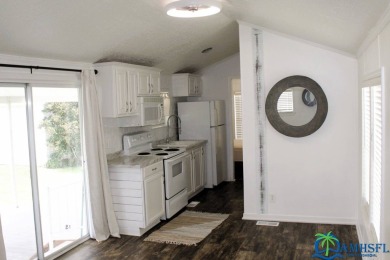 This super fun 1BR/1BA tiny home packs a lot of punch! This home on Lily Lake Golf and RV Resort in Florida - for sale on GolfHomes.com, golf home, golf lot