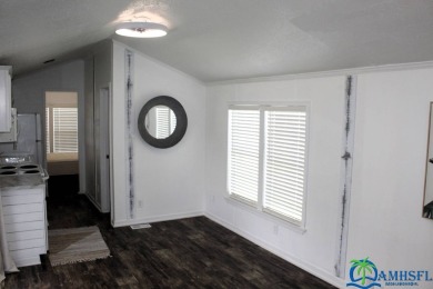 This super fun 1BR/1BA tiny home packs a lot of punch! This home on Lily Lake Golf and RV Resort in Florida - for sale on GolfHomes.com, golf home, golf lot