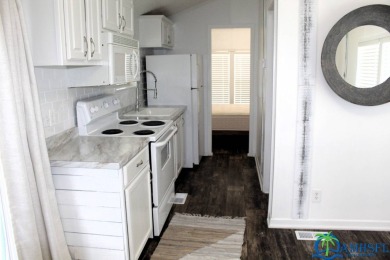 This super fun 1BR/1BA tiny home packs a lot of punch! This home on Lily Lake Golf and RV Resort in Florida - for sale on GolfHomes.com, golf home, golf lot