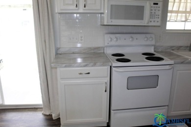 This super fun 1BR/1BA tiny home packs a lot of punch! This home on Lily Lake Golf and RV Resort in Florida - for sale on GolfHomes.com, golf home, golf lot
