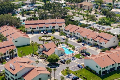 Discover the perfect blend of coastal charm and modern luxury in on The Dunedin Country Club in Florida - for sale on GolfHomes.com, golf home, golf lot