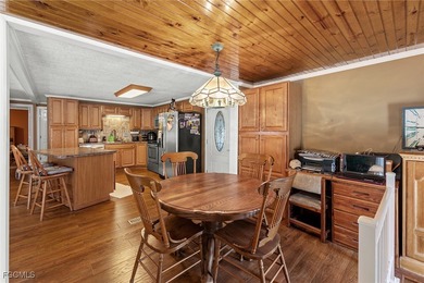 You'll love this unique manufactured home with RARE, attached on Six Lakes Country Club in Florida - for sale on GolfHomes.com, golf home, golf lot