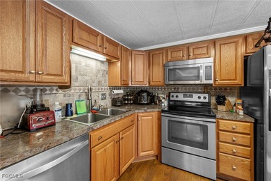 You'll love this unique manufactured home with RARE, attached on Six Lakes Country Club in Florida - for sale on GolfHomes.com, golf home, golf lot