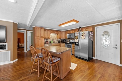 You'll love this unique manufactured home with RARE, attached on Six Lakes Country Club in Florida - for sale on GolfHomes.com, golf home, golf lot