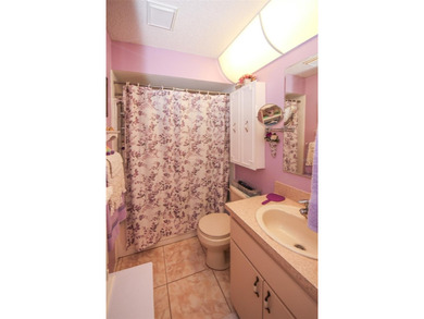 Immaculate second floor end unit in the beautiful Eagleswood on Beacon Woods Golf Club in Florida - for sale on GolfHomes.com, golf home, golf lot