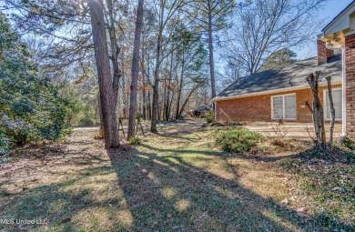 Discover this beautifully updated 3-bedroom, 2-bathroom home on Castlewoods Golf Club in Mississippi - for sale on GolfHomes.com, golf home, golf lot