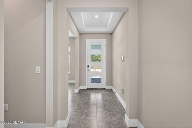 Welcome to The Lydia, a CFB Award-winning home that blends on LPGA International Golf Course in Florida - for sale on GolfHomes.com, golf home, golf lot