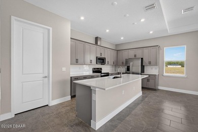 Welcome to The Lydia, a CFB Award-winning home that blends on LPGA International Golf Course in Florida - for sale on GolfHomes.com, golf home, golf lot