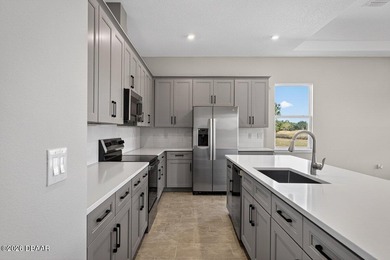 Welcome to The Lydia, a CFB Award-winning home that blends on LPGA International Golf Course in Florida - for sale on GolfHomes.com, golf home, golf lot