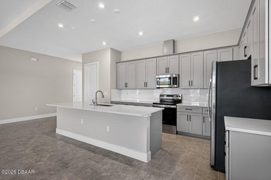 Welcome to The Lydia, a CFB Award-winning home that blends on LPGA International Golf Course in Florida - for sale on GolfHomes.com, golf home, golf lot