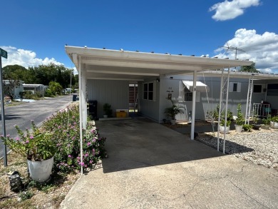 Free boat dock with access to the Dora Canal. The sunroom offers on Bay Tree Golf Course in Florida - for sale on GolfHomes.com, golf home, golf lot