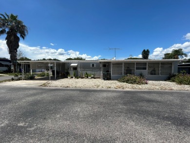 Free boat dock with access to the Dora Canal. The sunroom offers on Bay Tree Golf Course in Florida - for sale on GolfHomes.com, golf home, golf lot