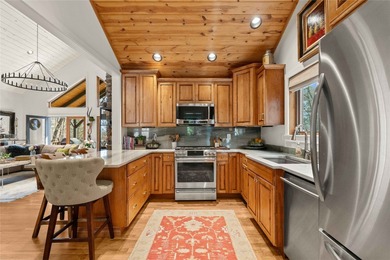 Nestled in a serene, wooded setting, this charming home offers on Sapphire National Golf Club in North Carolina - for sale on GolfHomes.com, golf home, golf lot