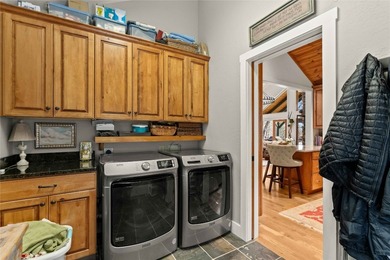 Nestled in a serene, wooded setting, this charming home offers on Sapphire National Golf Club in North Carolina - for sale on GolfHomes.com, golf home, golf lot