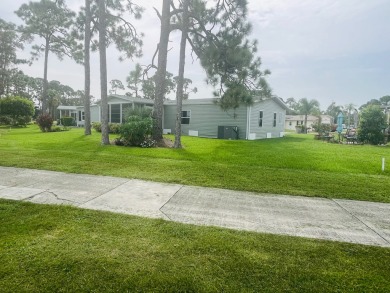 **Beautiful Home on the 17th green in Pine Lakes Country Club** on Pine Lakes Country Club in Florida - for sale on GolfHomes.com, golf home, golf lot