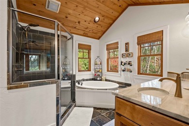 Nestled in a serene, wooded setting, this charming home offers on Sapphire National Golf Club in North Carolina - for sale on GolfHomes.com, golf home, golf lot