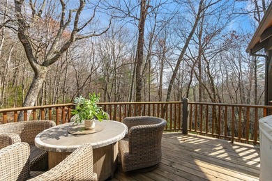 Nestled in a serene, wooded setting, this charming home offers on Sapphire National Golf Club in North Carolina - for sale on GolfHomes.com, golf home, golf lot