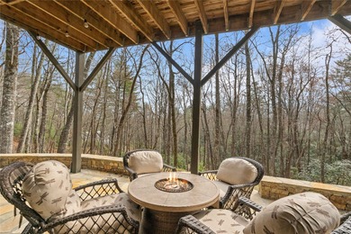 Nestled in a serene, wooded setting, this charming home offers on Sapphire National Golf Club in North Carolina - for sale on GolfHomes.com, golf home, golf lot
