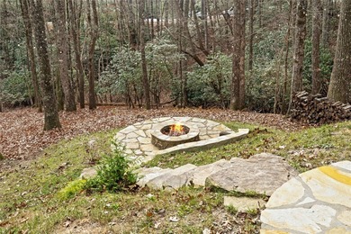 Nestled in a serene, wooded setting, this charming home offers on Sapphire National Golf Club in North Carolina - for sale on GolfHomes.com, golf home, golf lot