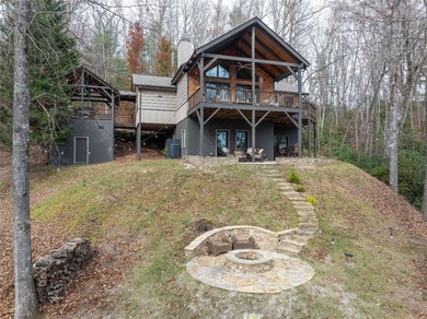 Nestled in a serene, wooded setting, this charming home offers on Sapphire National Golf Club in North Carolina - for sale on GolfHomes.com, golf home, golf lot