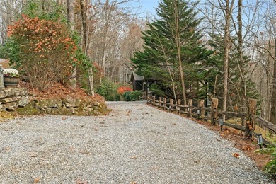 Nestled in a serene, wooded setting, this charming home offers on Sapphire National Golf Club in North Carolina - for sale on GolfHomes.com, golf home, golf lot