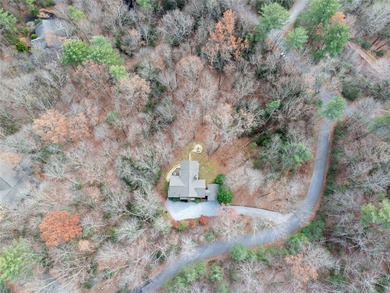 Nestled in a serene, wooded setting, this charming home offers on Sapphire National Golf Club in North Carolina - for sale on GolfHomes.com, golf home, golf lot