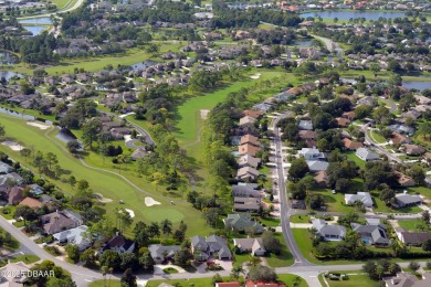 Nestled in the guard-gated Spruce Creek Fly-In community, this on Spruce Creek Golf Club in Florida - for sale on GolfHomes.com, golf home, golf lot