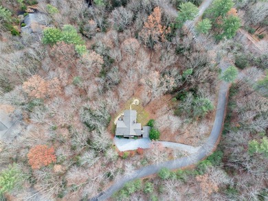 Nestled in a serene, wooded setting, this charming home offers on Sapphire National Golf Club in North Carolina - for sale on GolfHomes.com, golf home, golf lot