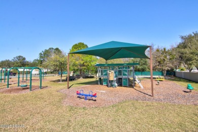 Nestled in the guard-gated Spruce Creek Fly-In community, this on Spruce Creek Golf Club in Florida - for sale on GolfHomes.com, golf home, golf lot