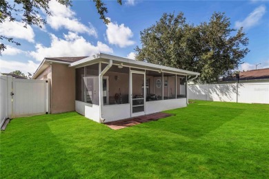 Welcome to this beautifully maintained 4-bedroom, 2-bathroom on Royal St. Cloud Golf Links in Florida - for sale on GolfHomes.com, golf home, golf lot