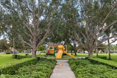 Welcome home to this beautiful end unit townhome in the heart of on Abacoa Golf Club in Florida - for sale on GolfHomes.com, golf home, golf lot