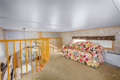 Discover cozy comfort in this beautifully maintained 1-bedroom on Beaver Dam Resort in Arizona - for sale on GolfHomes.com, golf home, golf lot