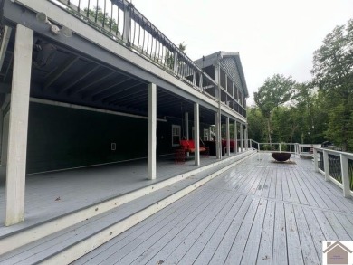 This inviting Lake Barkley Waterfront home with an easy walk to on Boots Randolph Golf Course in Kentucky - for sale on GolfHomes.com, golf home, golf lot