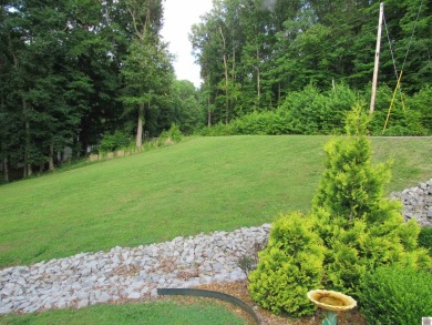 This inviting Lake Barkley Waterfront home with an easy walk to on Boots Randolph Golf Course in Kentucky - for sale on GolfHomes.com, golf home, golf lot