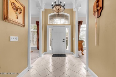 The epitome of luxurious, country club living, nestled within on Country Club of Orange Park in Florida - for sale on GolfHomes.com, golf home, golf lot