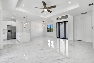 Experience modern luxury and family-friendly living in this on Lehigh Resort Club in Florida - for sale on GolfHomes.com, golf home, golf lot