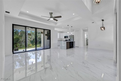 Experience modern luxury and family-friendly living in this on Lehigh Resort Club in Florida - for sale on GolfHomes.com, golf home, golf lot