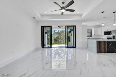 Experience modern luxury and family-friendly living in this on Lehigh Resort Club in Florida - for sale on GolfHomes.com, golf home, golf lot