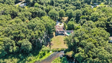 Sprawling, fully renovated walk-out ranch on over an acre with on Pine View Golf Club in Michigan - for sale on GolfHomes.com, golf home, golf lot