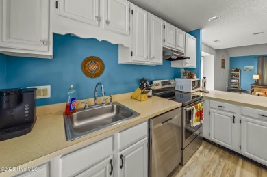 Resort community living is waiting for you.  This 2bd/2ba condo on Harbour Point Golf Club in North Carolina - for sale on GolfHomes.com, golf home, golf lot