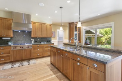 Tucked away on a quiet cul-de-sac in Eagle Ranch, this custom on Eagle Ranch in Colorado - for sale on GolfHomes.com, golf home, golf lot