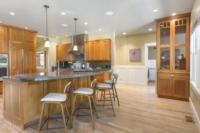 Tucked away on a quiet cul-de-sac in Eagle Ranch, this custom on Eagle Ranch in Colorado - for sale on GolfHomes.com, golf home, golf lot