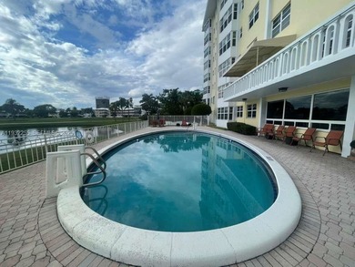 AMAZING *AS-IS* 2/2 corner unit Condo that sits on the beautiful on Coral Ridge Country Club in Florida - for sale on GolfHomes.com, golf home, golf lot