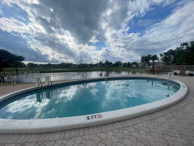 AMAZING *AS-IS* 2/2 corner unit Condo that sits on the beautiful on Coral Ridge Country Club in Florida - for sale on GolfHomes.com, golf home, golf lot